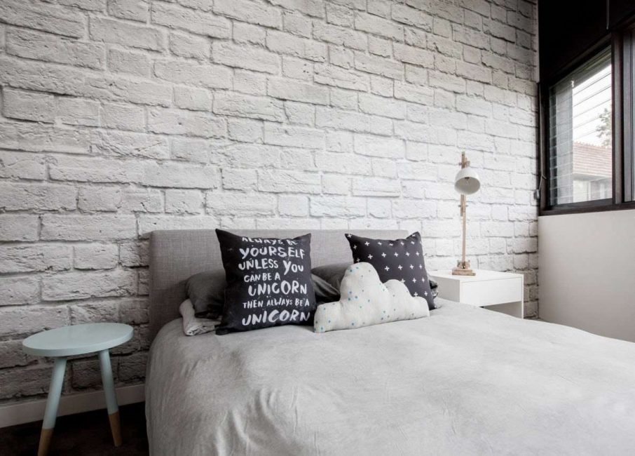 Snow-white brick wall in the bedroom of a private house