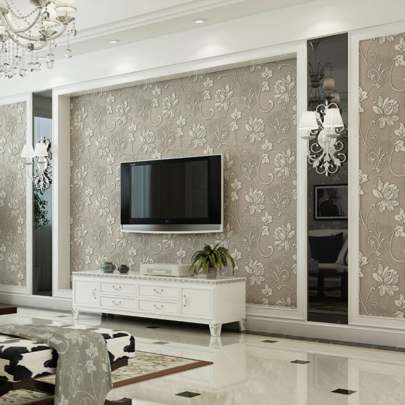 Black tv on the wall with beige wallpaper