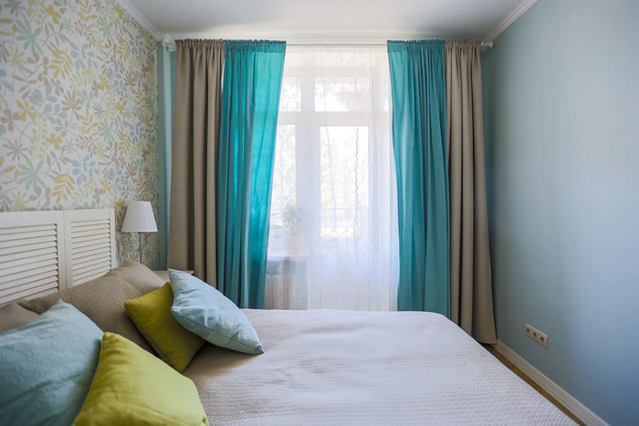 Bedroom with combined curtains on the window