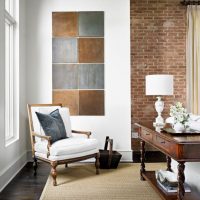 Panel of metal squares on the living room wall