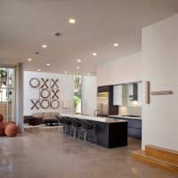 Crosses and zeroes on the wall of the kitchen-living room