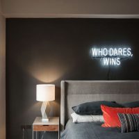 Neon sign in the bedroom interior