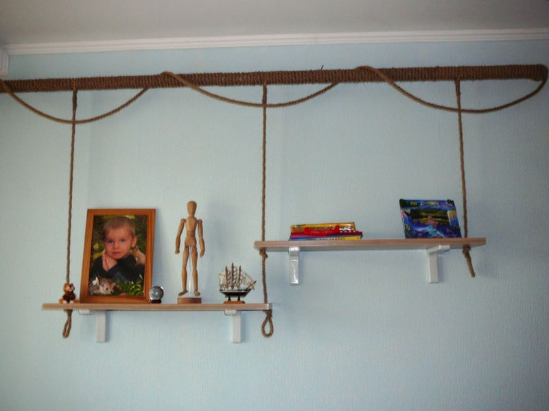 Shelves for souvenirs on the heating pipe