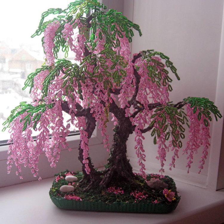 Bead tree on the windowsill of a city apartment