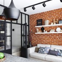 White shelves on a brick wall