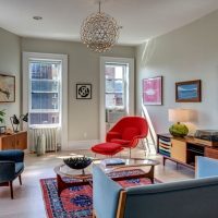 Interior of a corner living room in a brick house apartment