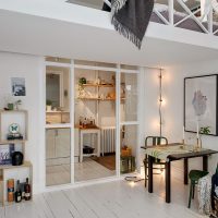 Gray bedspread on wooden railing