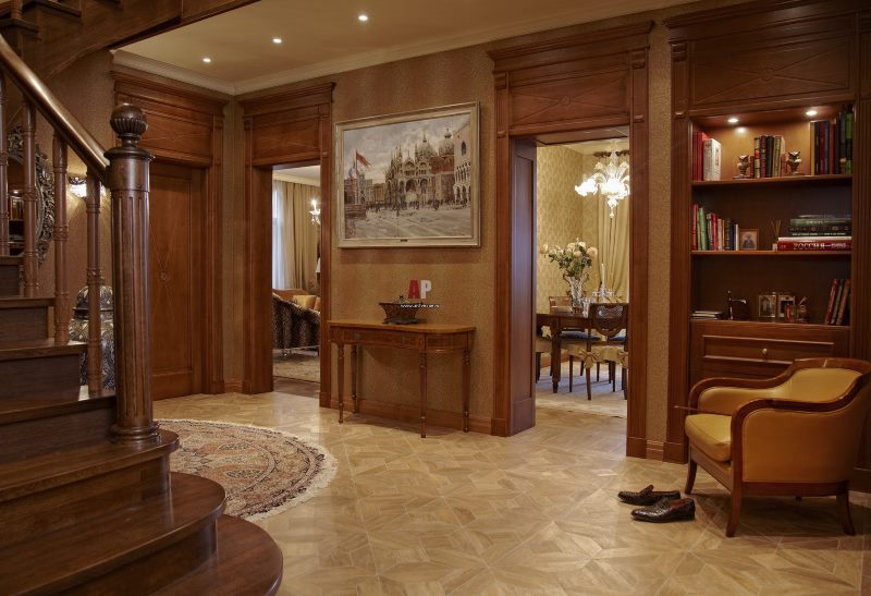 The interior of the first floor of a two-level apartment in a classic style