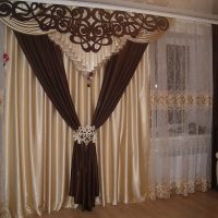 Curtains with a lambrequin on the living room windows