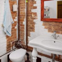 Copper pipes in a loft style bathroom