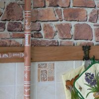 Painting pipes in the kitchen of a private house