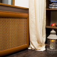 Beige curtain near the wooden screen