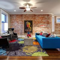 Blue sofa on the wooden floor