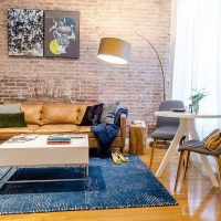 Modern living room with brick wall