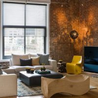 Brick walls in the living room with high ceiling