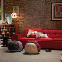 Red sofa in the design of the living room