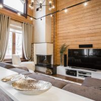 Design of a kitchen-living room in a house made of timber