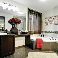 Red towel on the edge of the whirlpool bathtub