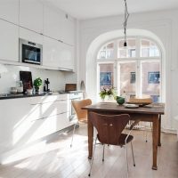 White kitchen with arched window