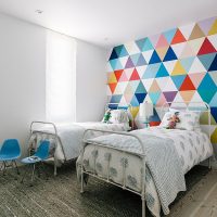 Multicolored triangles on paper wallpaper