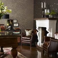 Leather chairs near the fireplace in the living room