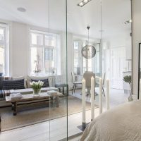 Living room interior with three windows