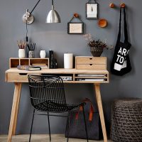 Wooden table near the gray wall