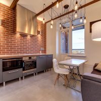 Light bulbs on wires in industrial style kitchen