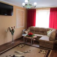 Red curtains in a small living room