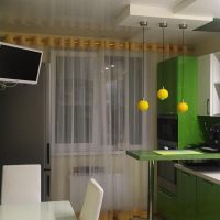 Green kitchen with breakfast bar