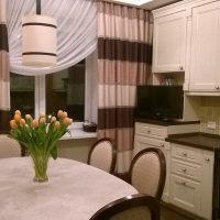 Striped curtains in the interior of the kitchen