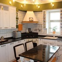 Kitchen design with hood in the corner