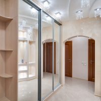 Wardrobe with mirrored doors in the hallway of a city apartment