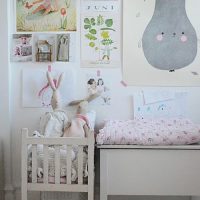 Children's drawings over the crib for the baby