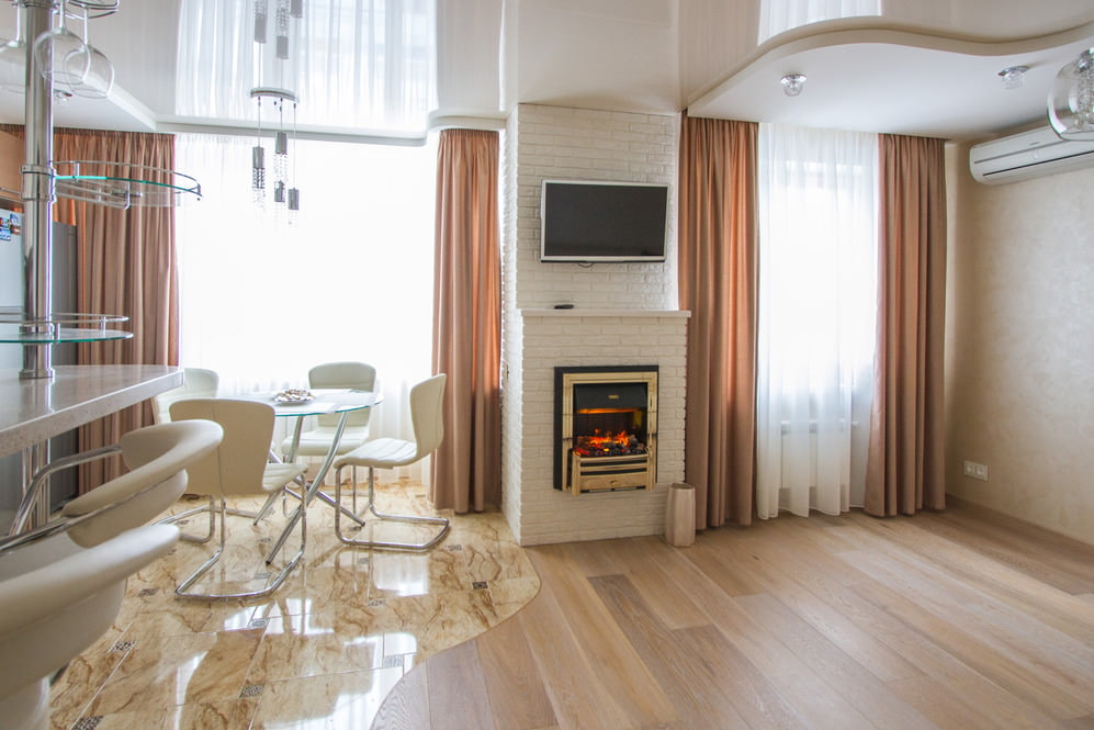 White brick fireplace in the living room interior