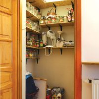 OSB shelves in the pantry of a small apartment