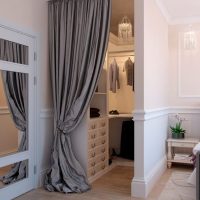 Gray curtain on the doorway of the bedroom closet