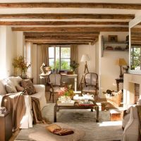 Bright living room with wood-beamed ceilings.