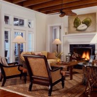 wooden chairs on the carpet in the living room