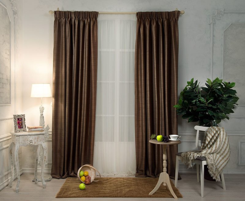 Straight brown curtains on the living room window