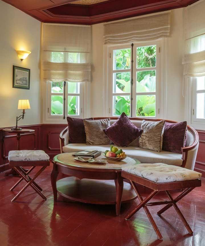 Roman curtains on the windows of the living room in a private house