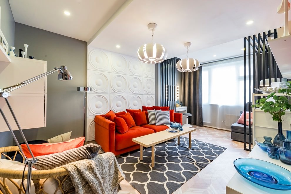 Red sofa in the interior design of a modern living room