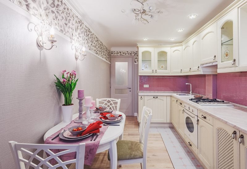 Narrow kitchen interior with white furniture