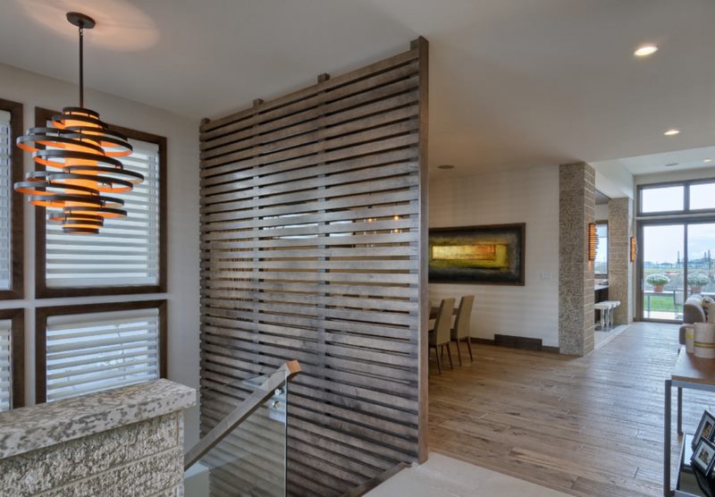 Wooden partition from slats on the second floor of a private house