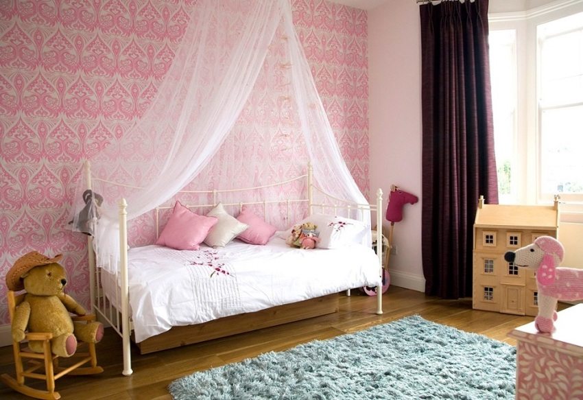 Pink wallpaper in the room for the baby