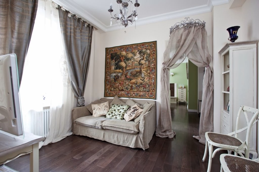 Provence style living room interior with gray sofa.