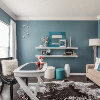 White shelves for storing decorations on the living room wall