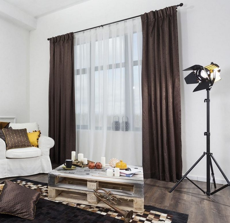 A combination of brown curtains with white tulle