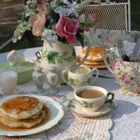 Fritters with honey in a porcelain plate