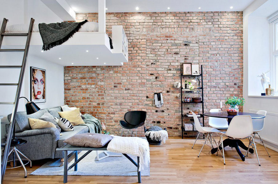 Living room interior with a bed on the second floor